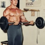 Man performing bicep curls for bigger biceps