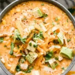 Bowl of high protein white chicken chili with herbs and spices