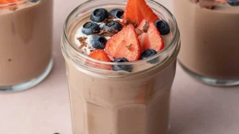 Chocolate Protein Pudding Recipe 2 Delicious chocolate protein pudding topped with berries and nuts