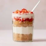 High Protein Cheesecake Jars with fresh berries and a creamy topping
