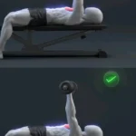 Dumbbell Bench Press 19 Person performing a dumbbell bench press exercise for upper body strength